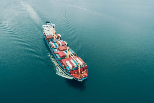 Aerial view of Cargo ship sailing in open sea