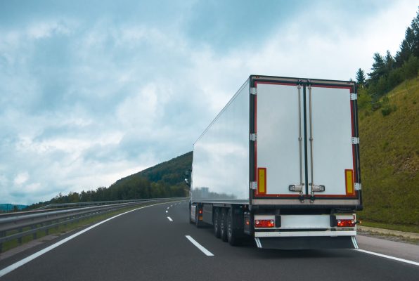 Semi truck with trailer on highway road